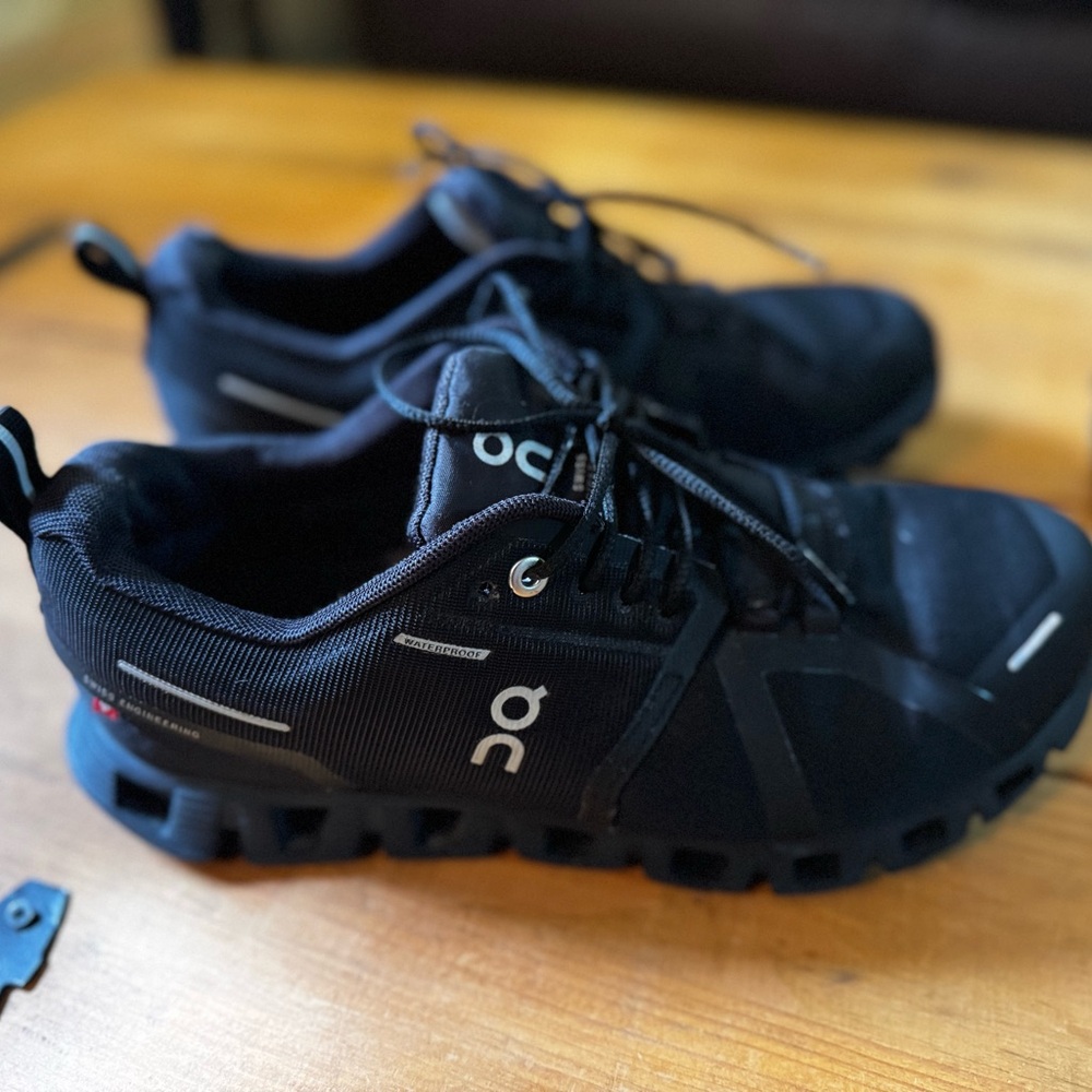 On Running Black Sneakers with CloudTec Technology
